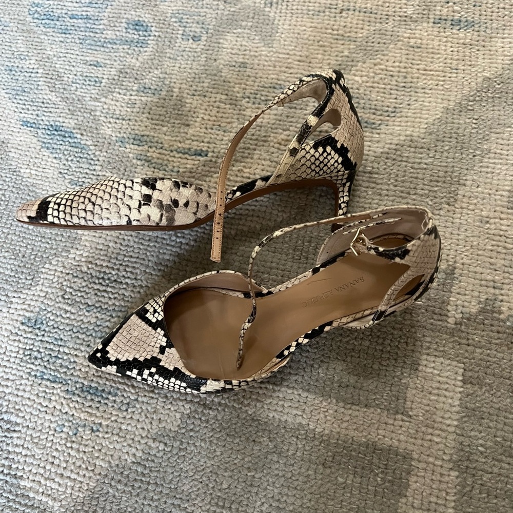 Banana republic snakeskin pumps size 8. See pics for wear.